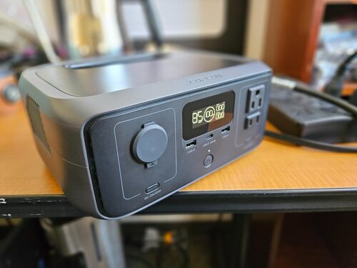 EcoFlow RIVER 3 power station on a desk with display active and front charging ports visible