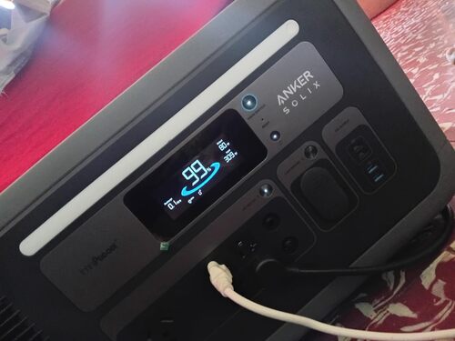 Anker SOLIX F3000 display showing 99% battery while powering devices indoors