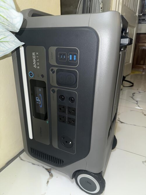 Anker SOLIX F3000 side view showing wheels, front outlets, USB ports, and compact rolling design
