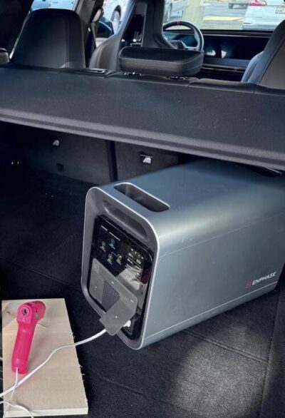 Enphase IQ PowerPack 1500 powering a hot glue gun from the back of a vehicle