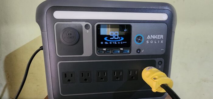 Anker SOLIX C1000 portable power station display showing 98% battery while powering a device