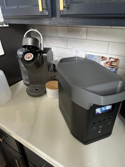 EcoFlow Delta 2 portable power station on a kitchen counter next to a coffee maker