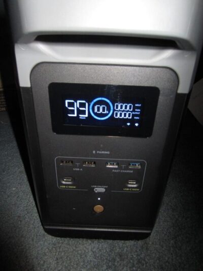 Close-up of EcoFlow Delta 2 screen showing battery level, runtime, and USB charging ports
