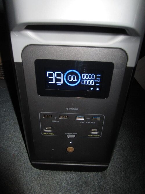 Close-up of EcoFlow Delta 2 screen showing battery level, runtime, and USB charging ports