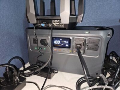 DJI Power 1000 V2 used as backup power for a Wi-Fi router and home electronics setup