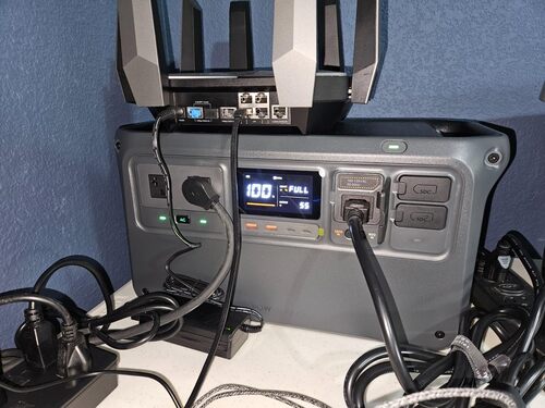 DJI Power 1000 V2 used as backup power for a Wi-Fi router and home electronics setup