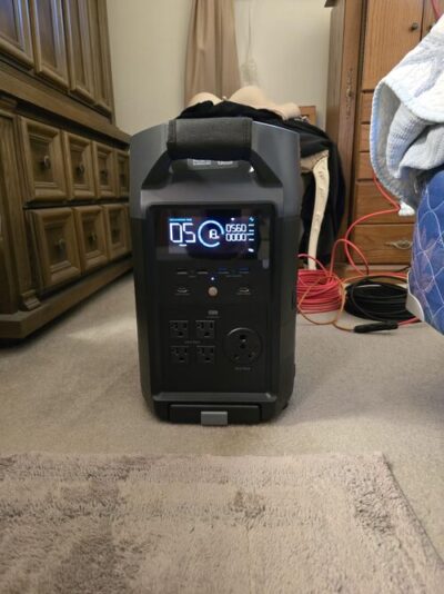 EcoFlow DELTA Pro charging indoors with front display, USB ports, AC outlets, and 30 amp RV outlet visible
