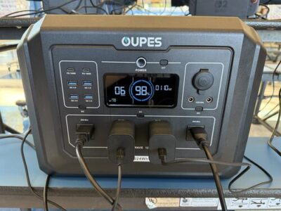 OUPES Mega 1 portable power station front panel showing AC, USB-C, USB-A, and 12V ports in use