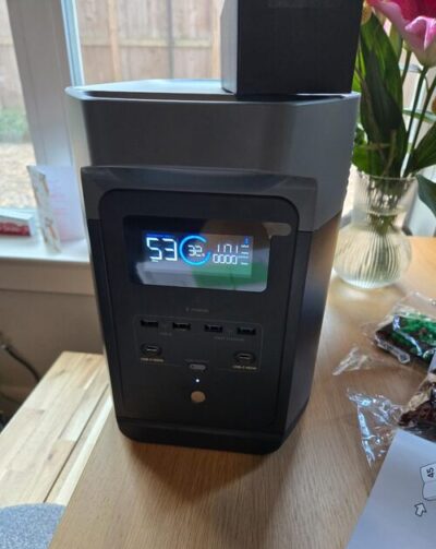 EcoFlow Delta 2 power station showing battery display and front charging ports on a table