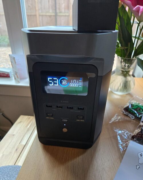 EcoFlow Delta 2 power station showing battery display and front charging ports on a table