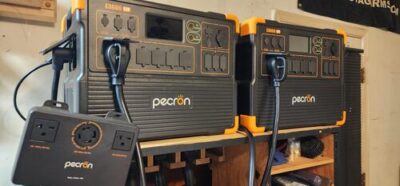 Two Pecron E3600LFP power stations connected with a split phase output box for home backup power