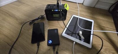 MARBERO M82 power station charging a phone, tablet, and small power bank during indoor backup use
