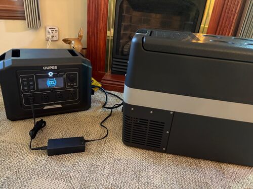 OUPES Mega 1 portable power station powering a portable refrigerator during indoor backup testing