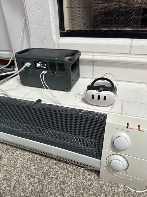 DJI Power 1000 V2 powering a space heater and VR headset indoors during home use