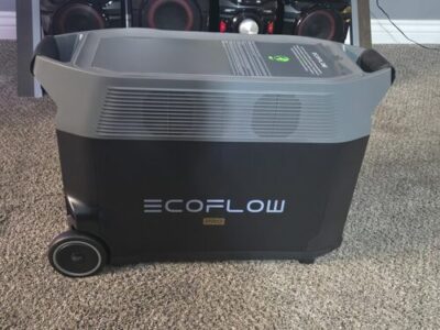 Side view of EcoFlow DELTA Pro power station showing cooling vents, wheels, and large body for home backup power
