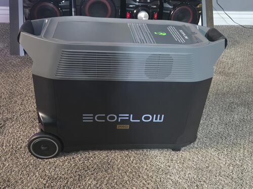 Side view of EcoFlow DELTA Pro power station showing cooling vents, wheels, and large body for home backup power