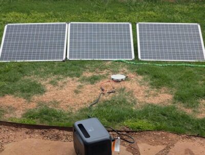 BLUETTI Elite 100 V2 charging from multiple solar panels in a backyard off-grid power setup