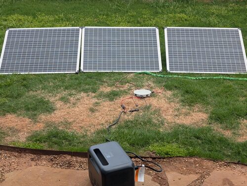 BLUETTI Elite 100 V2 charging from multiple solar panels in a backyard off-grid power setup