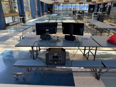 OUPES Mega 1 powering monitors and gaming consoles for an indoor school esports setup