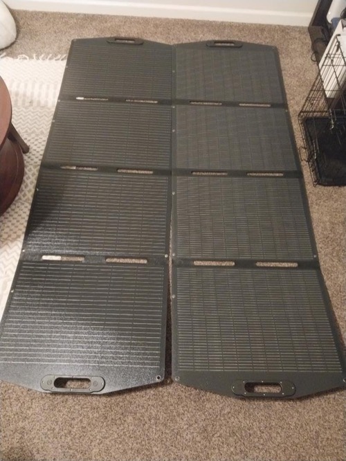 ECO-WORTHY 200W portable solar panel unfolded flat across the floor showing its four-segment quad-fold layout