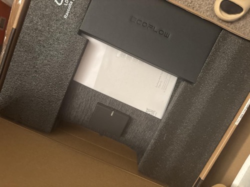 EcoFlow 45W solar panel being unboxed, showing the folded panel, manual, and EcoFlow-branded foam packaging inside the box
