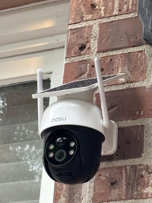 AOSU C9C2 installed on brick with its panel above the moving camera head
