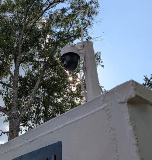 Reolink Go PT S Lite installed high on a customer's outdoor structure