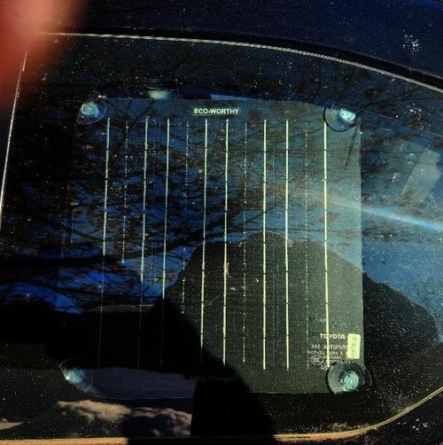 Customer photograph of the ECO-WORTHY 10W panel viewed through vehicle glass