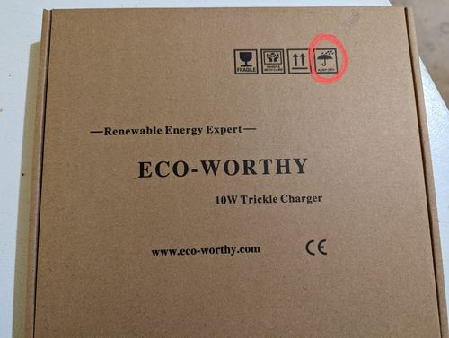 Customer photograph of an ECO-WORTHY 10W Trickle Charger box with a keep-dry packaging symbol
