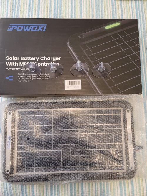 Customer photo of the POWOXI 12W package, wrapped panel and four suction cups